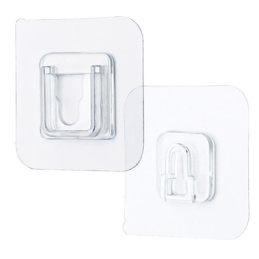Transparent adhesive hook for wall, perfect for hanging items without damage to surfaces.