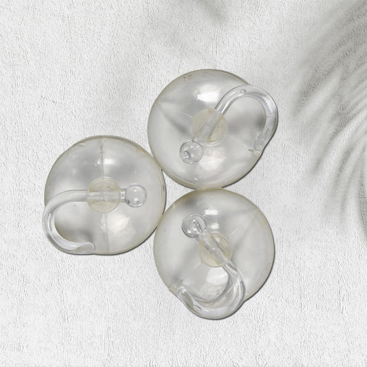 Set of three transparent rubber vacuum hangers for secure hanging solutions in home improvement projects