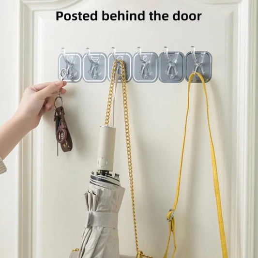 Transparent waterproof hooks for bathroom mounted behind door holding keys, umbrella, and bag