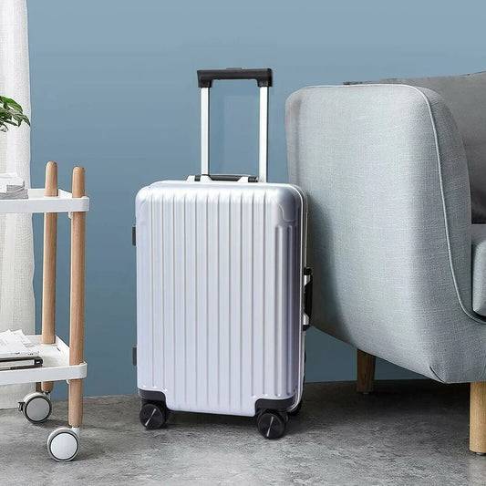 Stylish silver trolley bag set for men and women with a retractable handle and smooth wheels