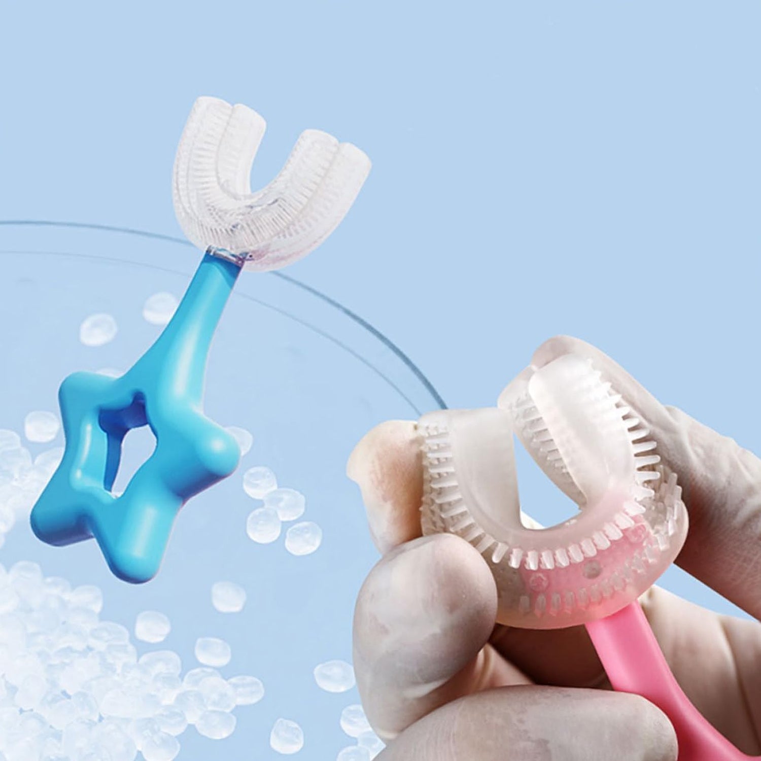 U-shape silicone toothbrush for kids in pink and blue colors with ergonomic design for easy brushing