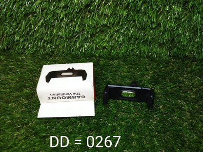 Universal car air vent phone holder in black with packaging displayed on grass background