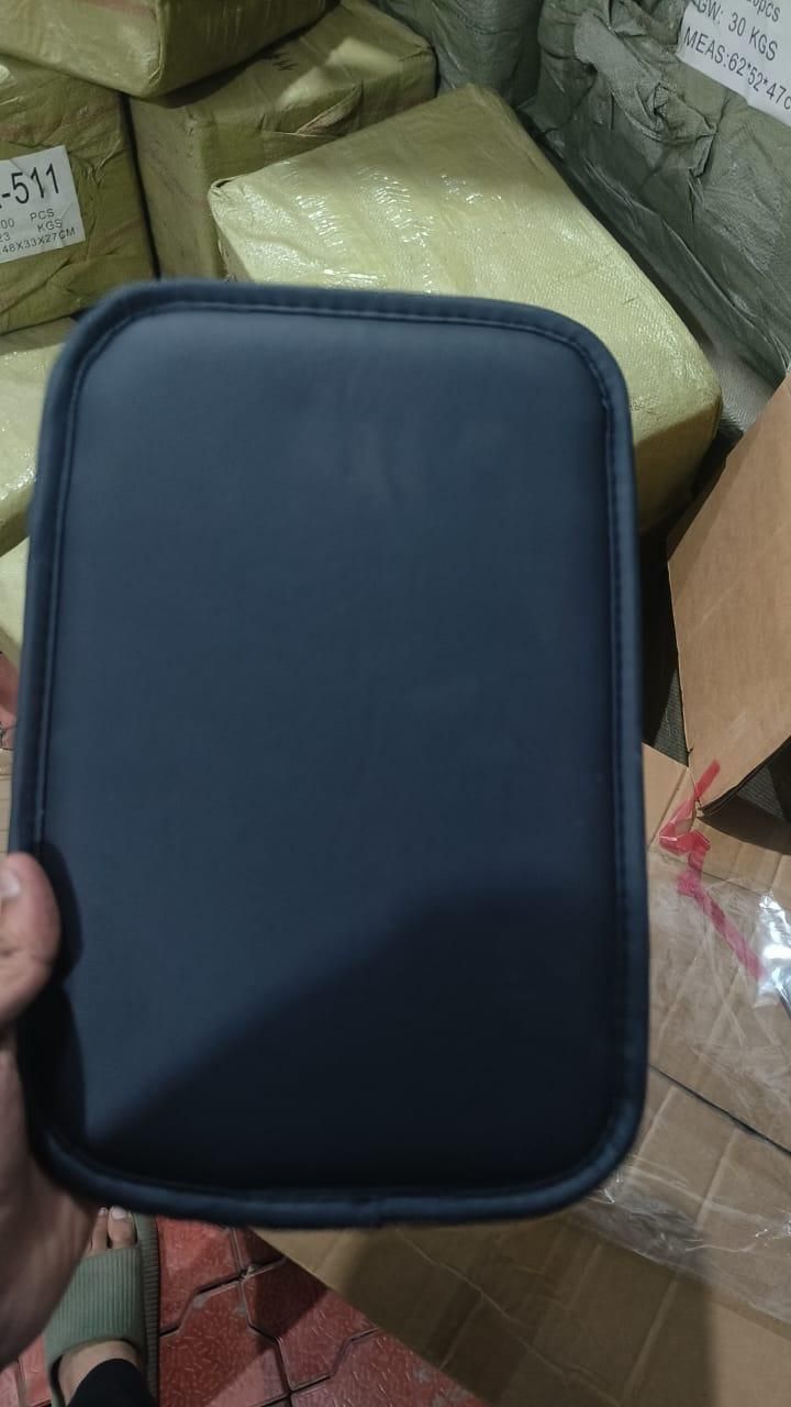 Universal car armrest cushion in black, providing comfort for long drives and easy installation