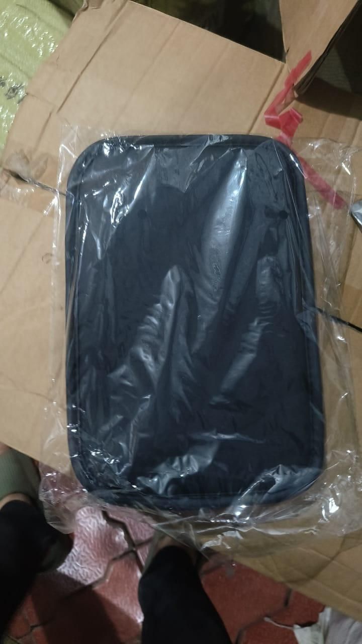 Universal car armrest cushion in black packaging, designed for added comfort while driving