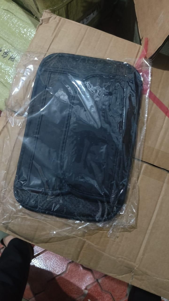 Universal car armrest cushion in black packaging ready for comfortable arm support during drives
