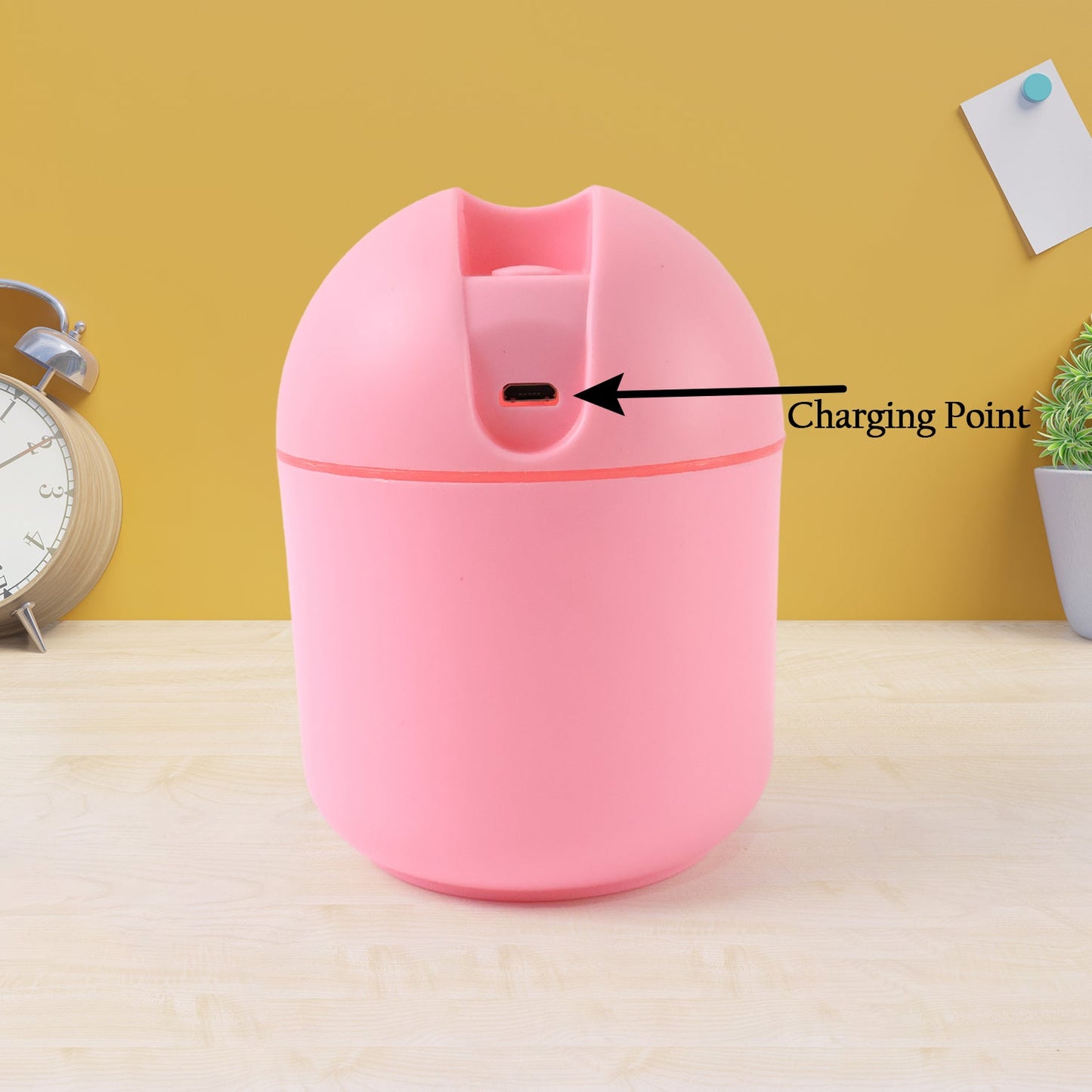 USB mini air humidifier in pink color with a visible charging point for easy refilling