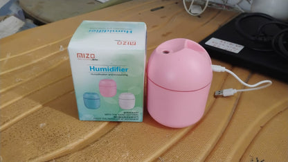 USB mini air humidifier in pink with box for easy portability and use at home or office