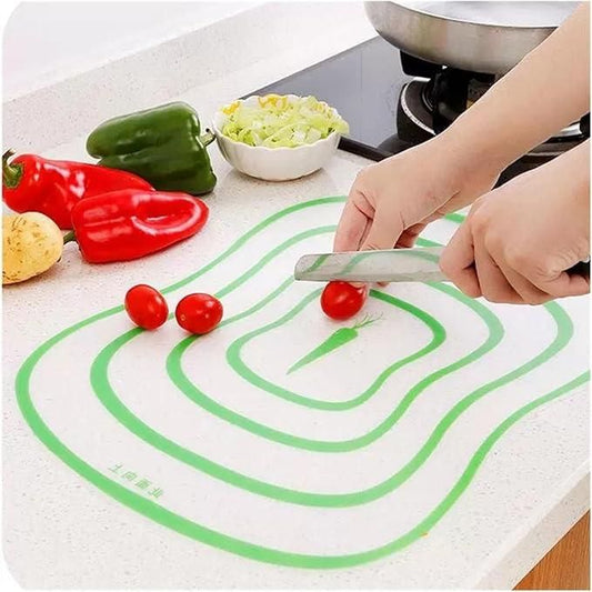 THE GIR FARMER flexible food prep board for vegetables with green patterns used to cut cherry tomatoes on kitchen counter