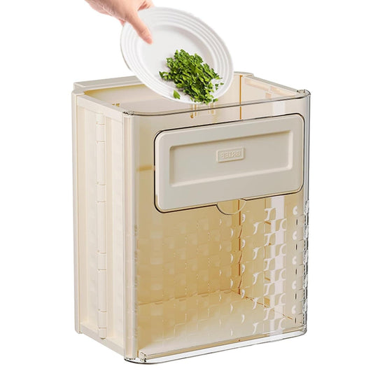 The Gir Farmer foldable wall mounted trash can in beige being used to dispose of food scraps