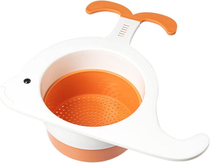 Whale drain basket for kitchen in white and orange with a whale-shaped design and handle
