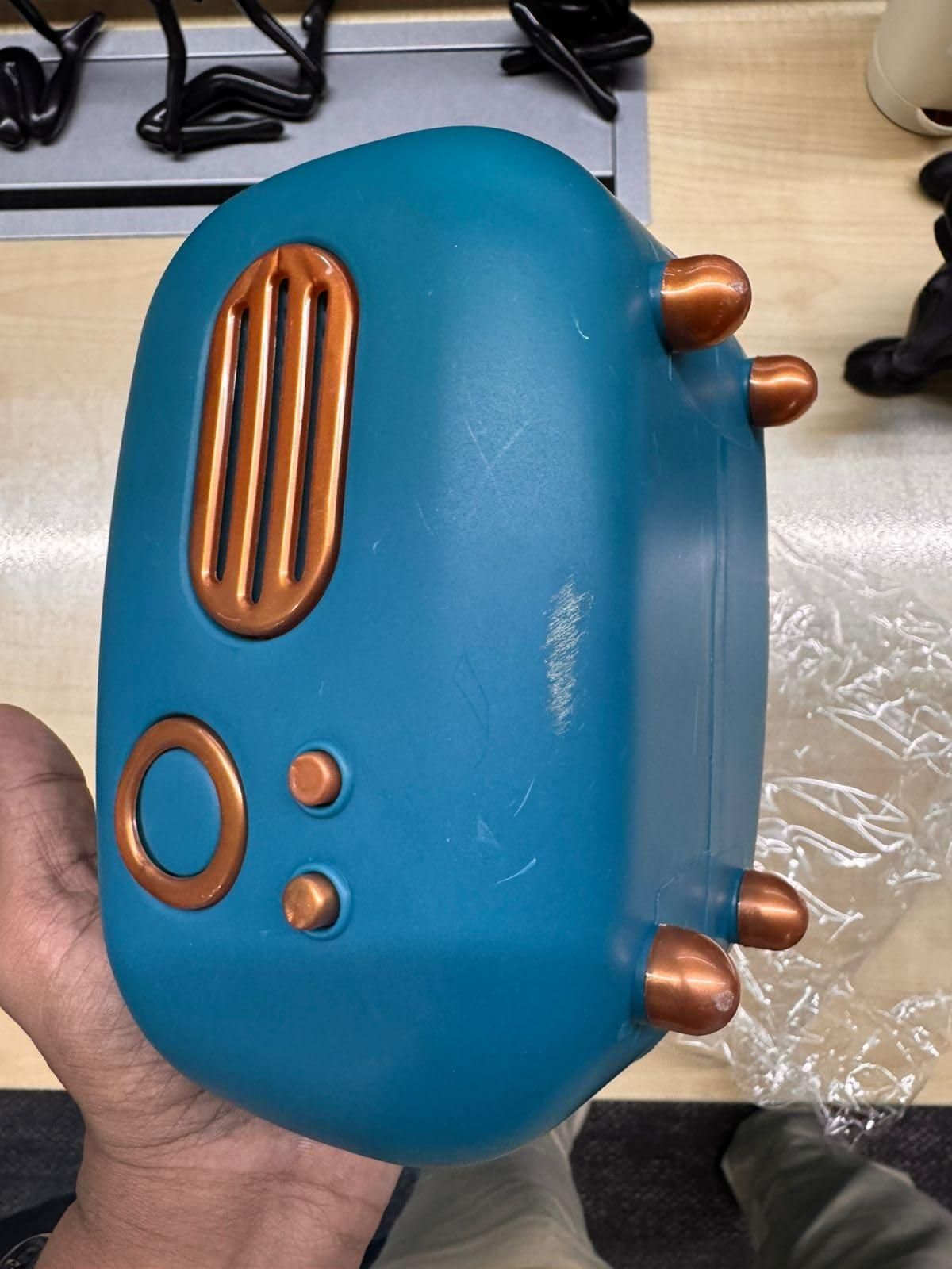 Vintage radio tissue box in teal with copper accents, ideal for adding retro charm to any room