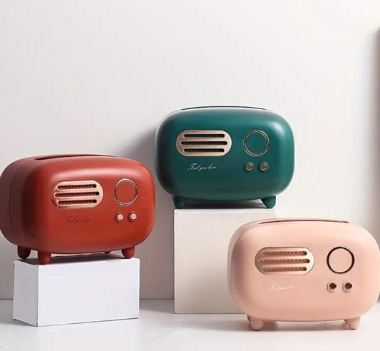 Decorative vintage radio tissue box in red, green, and pink for a retro-style home
