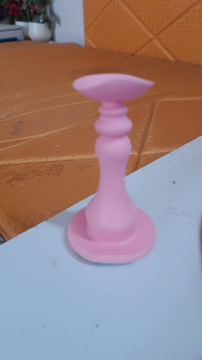 Pink washing machine door holder designed to keep appliance doors open for convenience