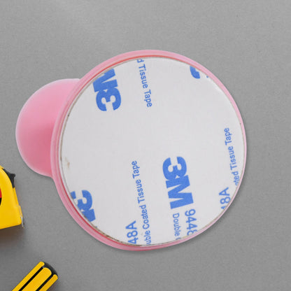 Pink washing machine door holder with strong adhesive backing for secure closure