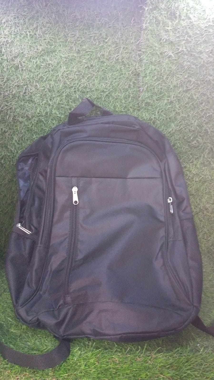 Your Brand water-resistant laptop backpack in black with multiple compartments for organization