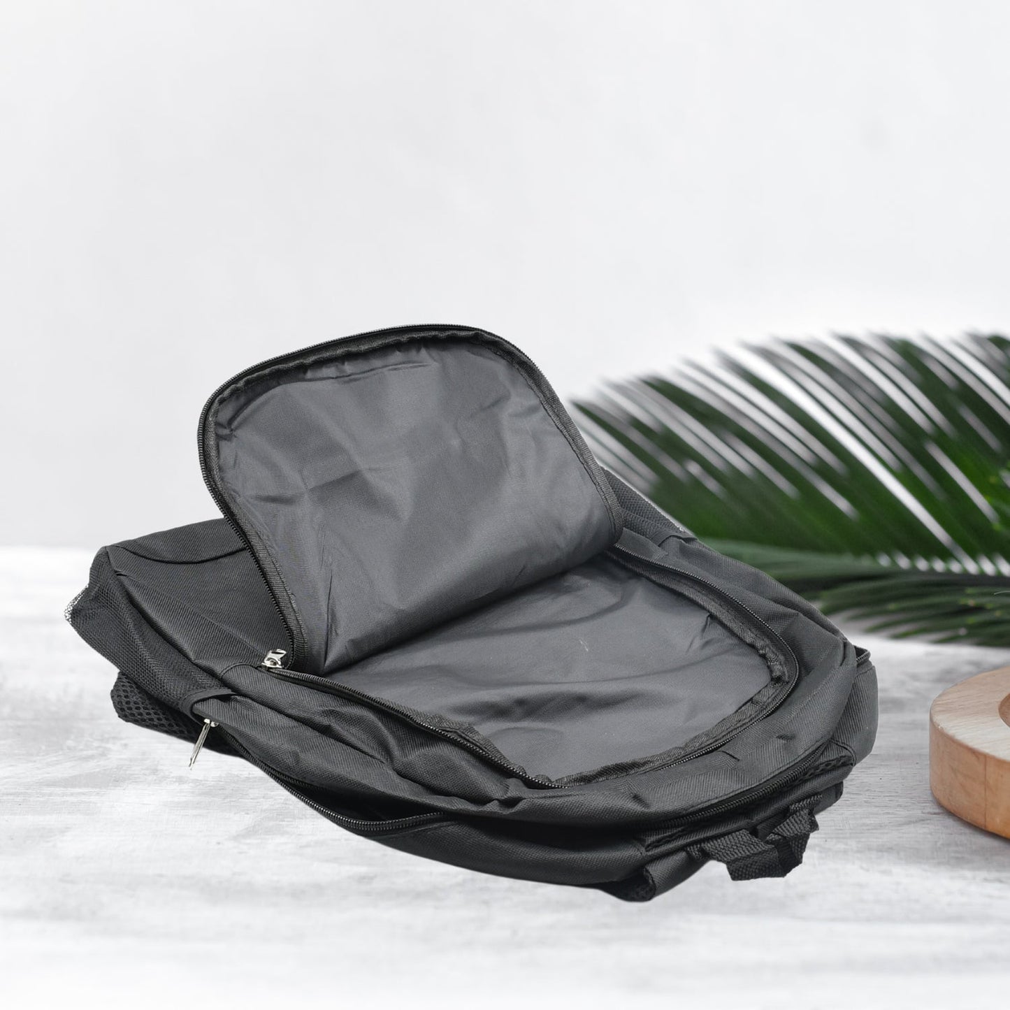 Interior view of a black water-resistant laptop backpack with spacious compartments for organization