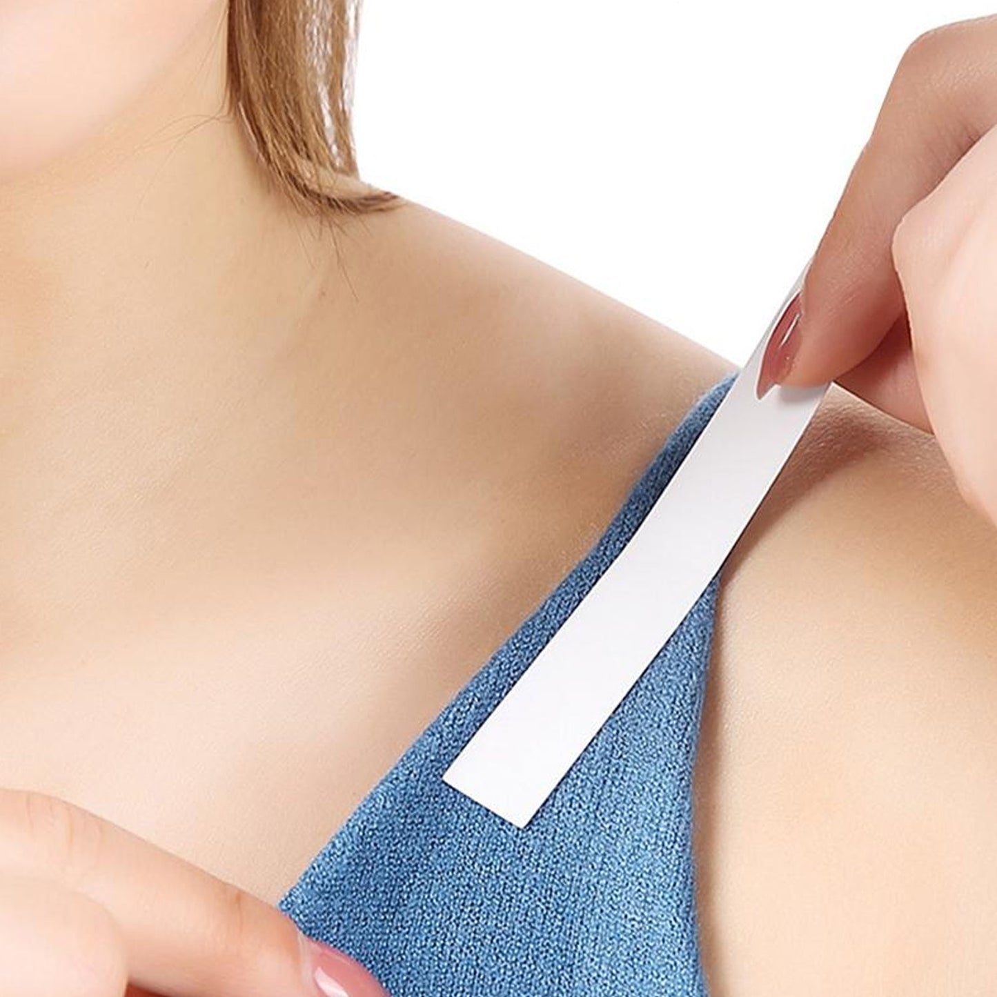 Waterproof medical tape for lingerie on a model's shoulder to secure clothing
