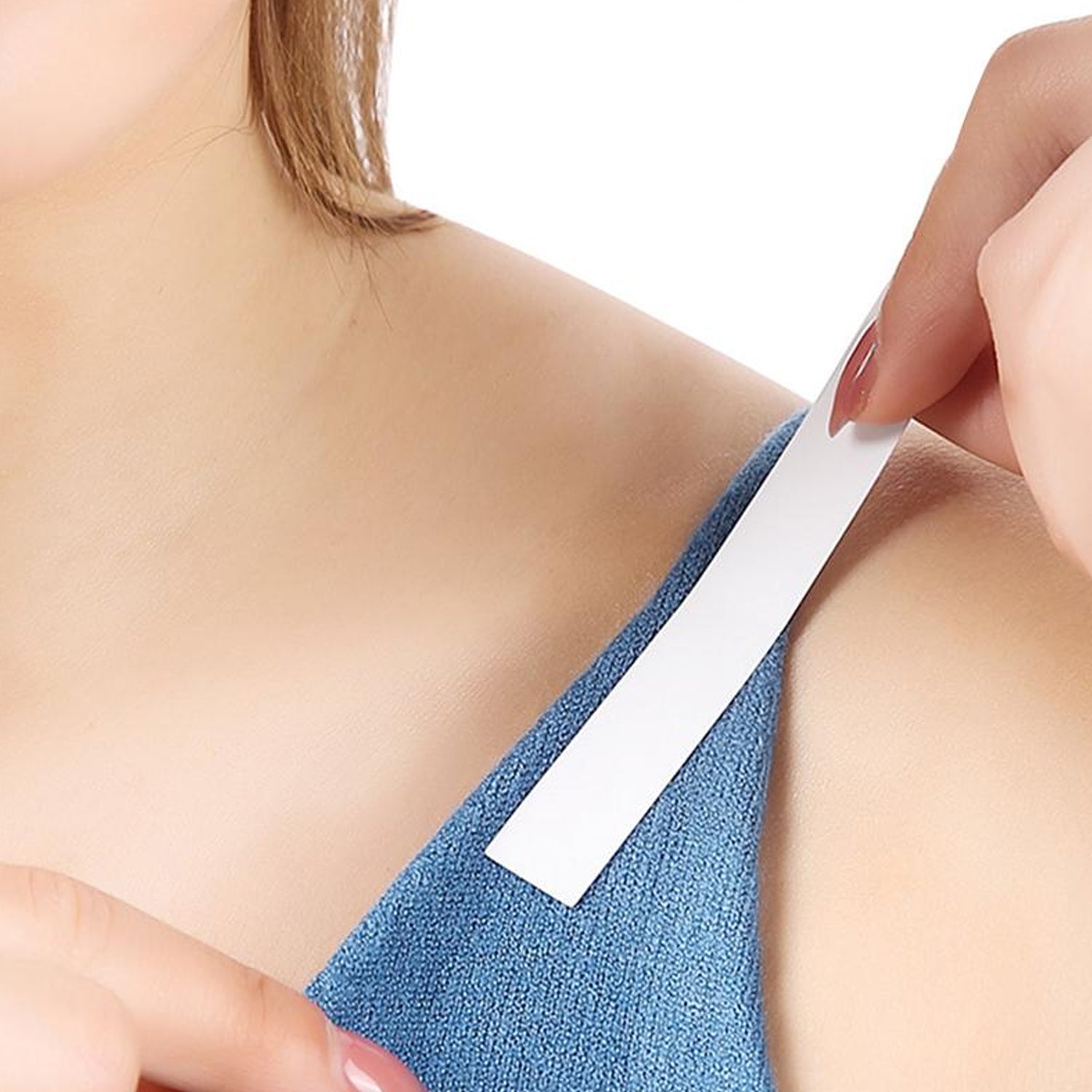 Waterproof medical tape for lingerie on a model's shoulder to secure clothing