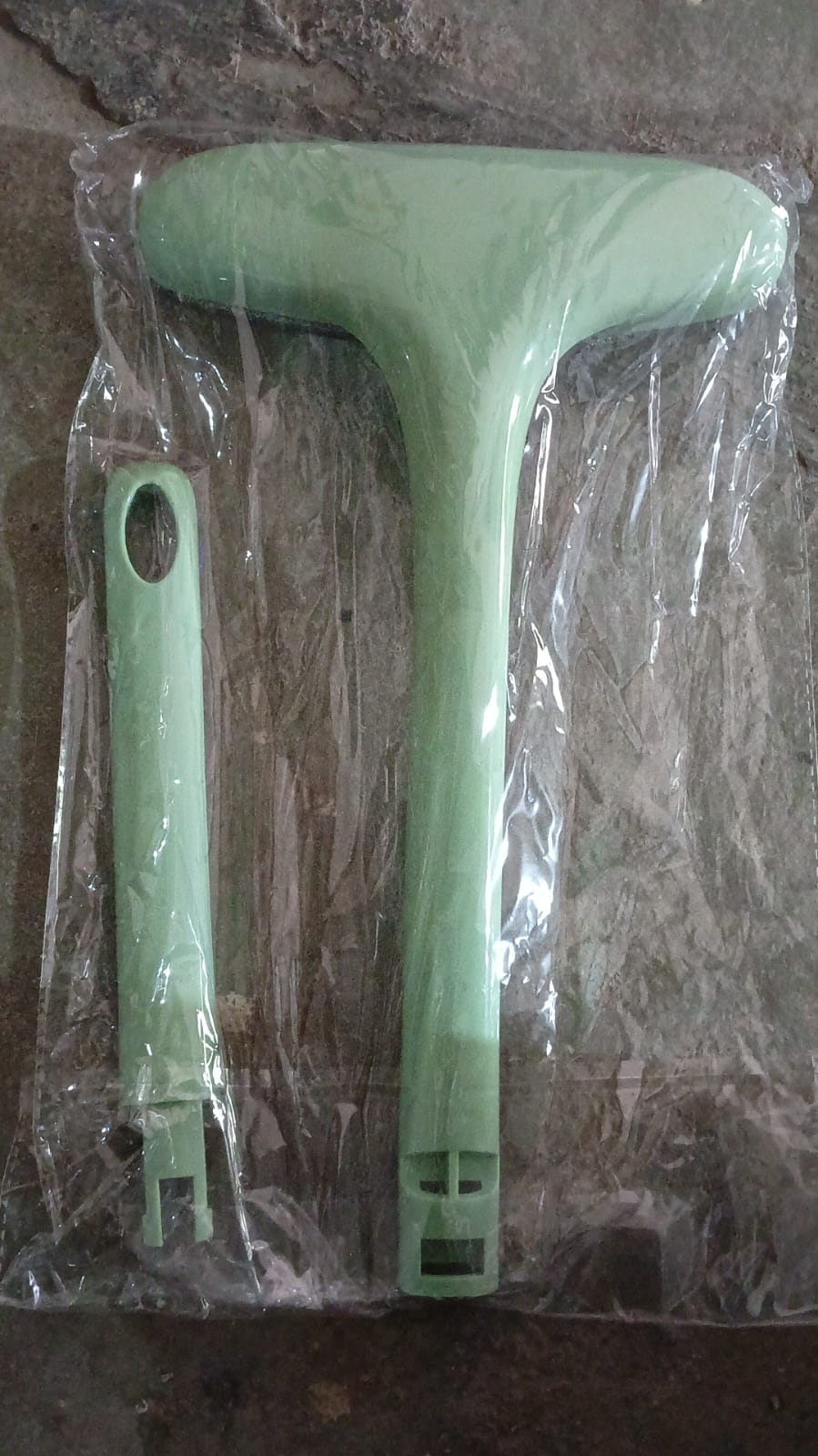 Your Brand window screen cleaning brush in green color with detachable handle for easy cleaning