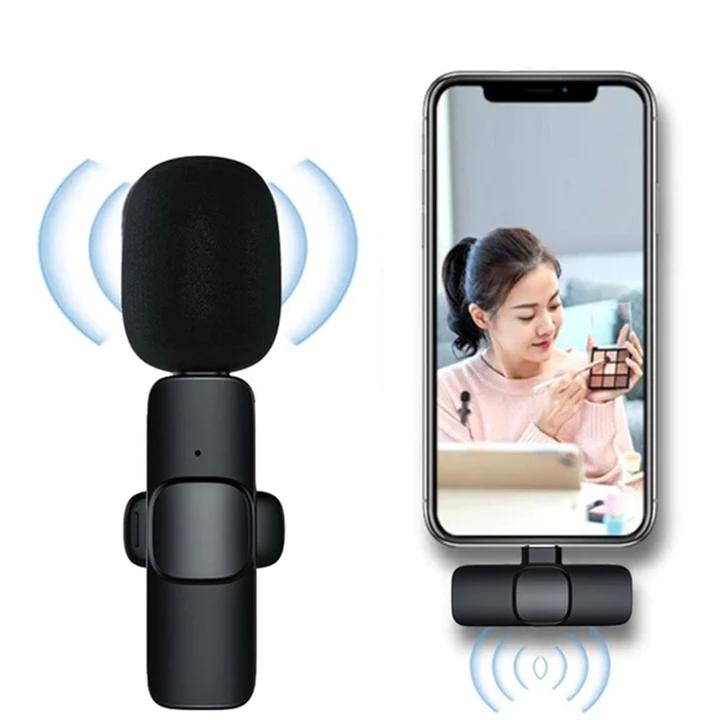 Wireless lavalier microphone for recording with phone setup and user applying makeup