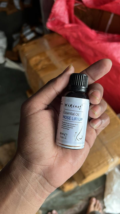 Bottle of 30ml nose lifting oil in hand for enhancing facial contour and lift