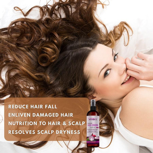 onion black seed hair oil bottle with a woman enjoying healthy, shiny hair on a bed