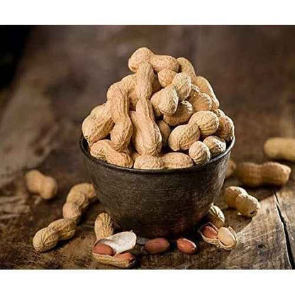 Brown organic raw groundnuts in a rustic bowl, perfect for snacking or cooking